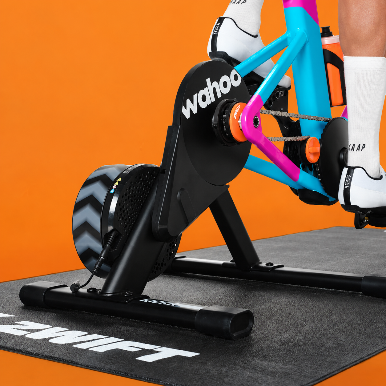 Wahoo trainer connected to the colourful Zwift Ride frame during a ride
