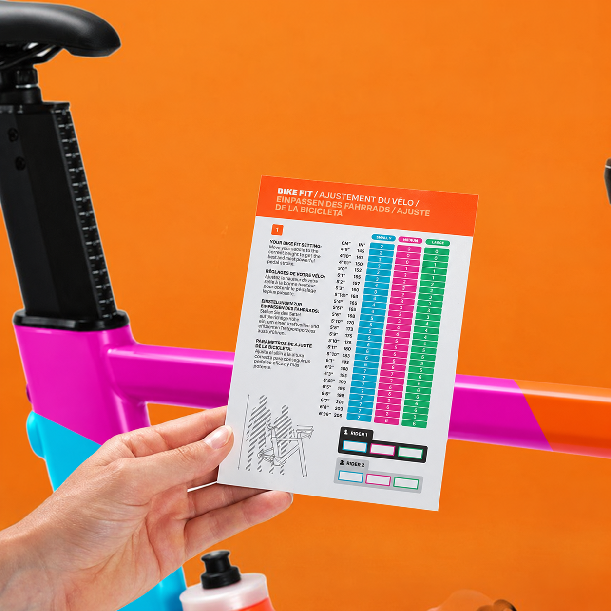Colourful Zwift Ride frame with saddle adjustment and rider fit guide